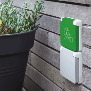 niko charger on wall wtih plant